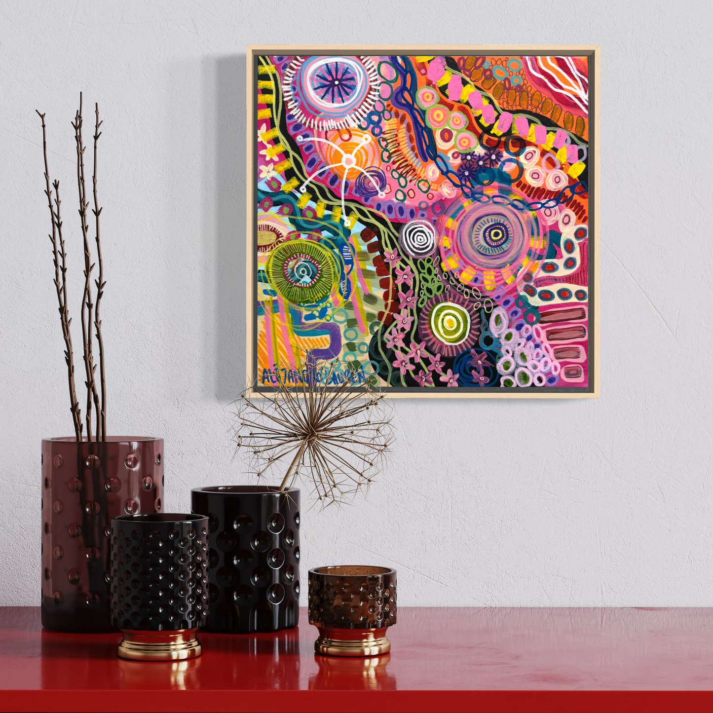 Colour Chaos framed 30 x 30 cm Aboriginal original painting by Aléjandro Lauren displayed above colourful home decor